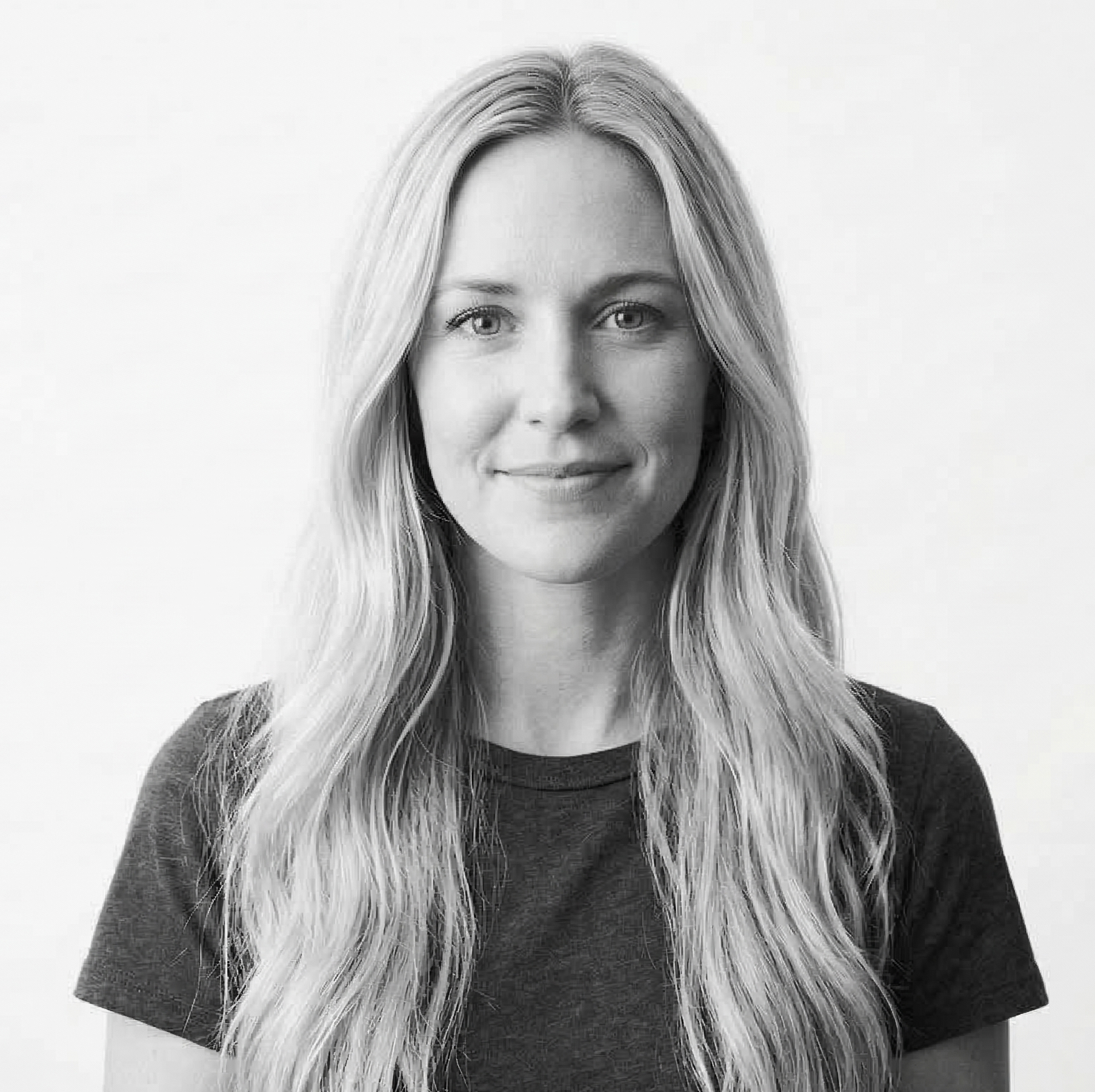 Professional black and white portrait of Sarah Anderson, Wellness and Lifestyle Editor, smiling warmly against a clean white background.